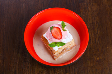 Cake with ice cream served stravberry