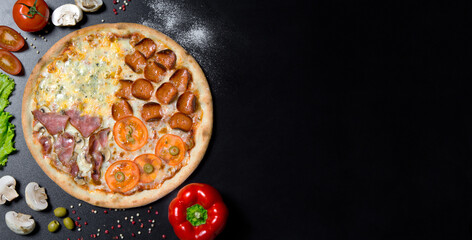 Italian pizza and ingredients and spices for cooking mushrooms, tomatoes, pepper, salt, herbs and alive on a black concrete background.Top view of pizza four seasons .Pizza food photo for menu.