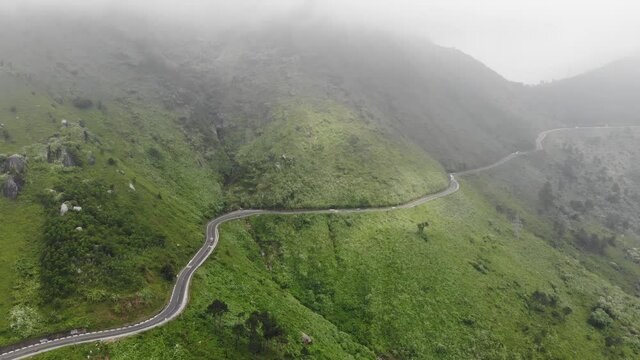 A long and curvey road along the mountains heading to Hue in Vietnam