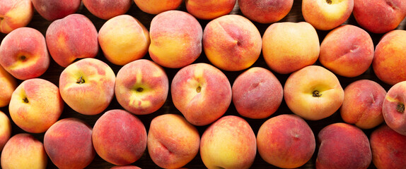 fresh peaches as background, top view