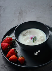 Strawberry in the bowl, black and white background