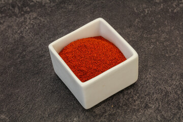 Dry paprika powder in the bowl