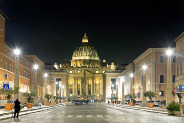 The Saint Peter cathedral of Vatican at night. The cathedral is one of the most famous travel distinations of the world and the largest catholic church