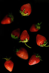 Strawberry in the bowl, black and white background