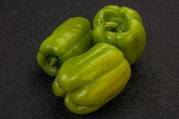 Three green bell juicy peppers