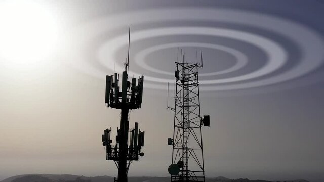 Radio and cellular Antennas silhouette Emitting Waves 

Beautiful slow fly shot of Radio and cellular Antenna silhouette- 5G Concept

