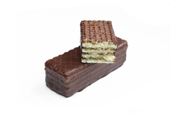 Two chocolate covered wafers isolated on white background.  Sweet snack close-up