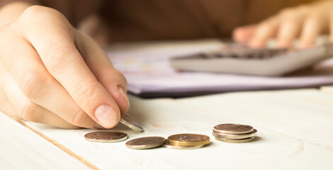 Budget planning in crisis. Female hands consider dollars, panorama