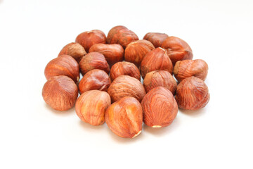 Peeled hazelnuts isolated on white background. No shell