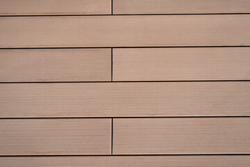 Obraz premium The texture of the flooring of wooden boards with parallel lines, tinted in a monotone brown color