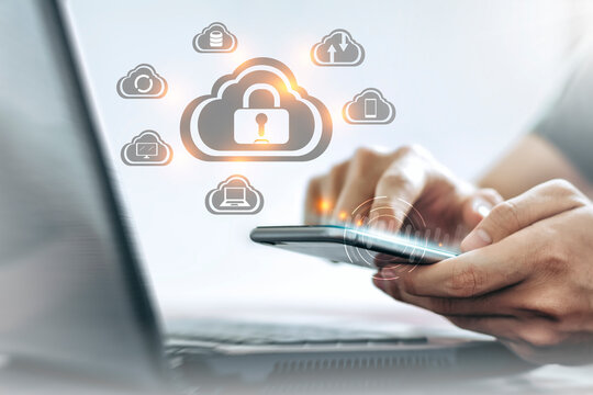 Young Asian man is holding a smartphone, Personal data Security lock cyber is a key safe device protection upload backup data on the cloud keep for privacy database. Concept of preventing data theft