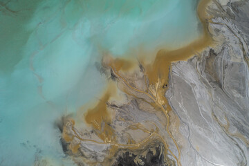 Industrial coal mine, abstract sendimentation tank of power plant , turquoise water like river delta