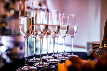 glasses of champagne on table. blurred background