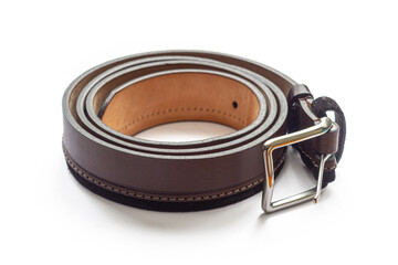 Rolled up leather Trouser belt on white
