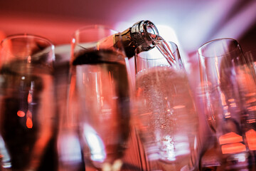 Glass of champagne. Red light
