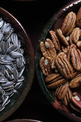 Bowls with sunflower seeds and pecans