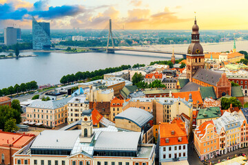 Panoramic view of the city of Riga, Latvia from the tower Church of St. Peter during sunset in summer. - obrazy, fototapety, plakaty
