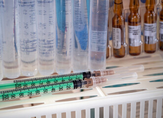Background for treatment rooms, clinics, hospitals, business, industry with syringes, ampoules and...