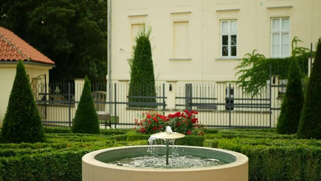 Garden park in Olomouc, fountain iron landmark historical monument reserve architecture memorial, tank water jet height spout spouting squirt spring, on walls during reign of Maria Theresa, baroque