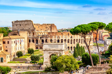 Fototapeta na wymiar The Colosseum and Arch of Constantine in Rome, Italy during summer sunny day. The world famous colosseum landmark in Rome.