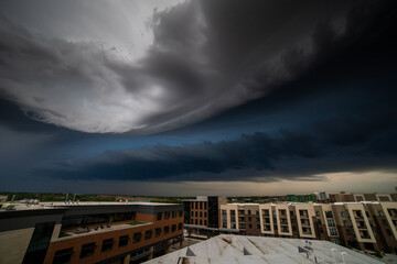 Storm front rolling over a small city in kansas