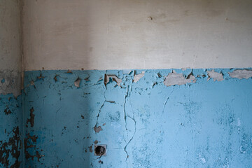 Background of the old wall in the abandoned apartment. Old paint cracked