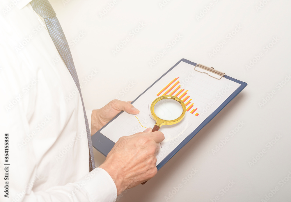 Poster chart business chart diagram falling trend statistic loupe in businessman hand. red and orange chart