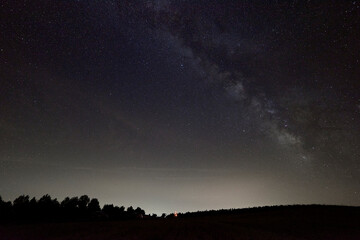 Obraz na płótnie Canvas The Milky Way at night over Mountains