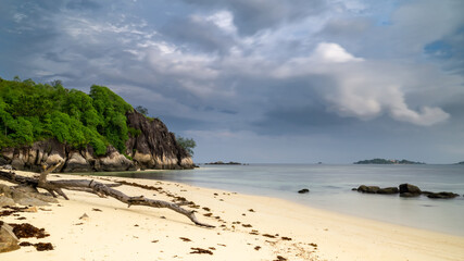 Beautiful tropical seascape with crystal clear sea water turquoise color sand blue sky at Seychelles islands. Tropical background scenic.