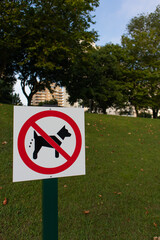 Sign of prohibition of dog excrement in a park