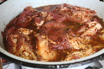 marinated pork meat on the ribs with spices Provencal herbs for frying