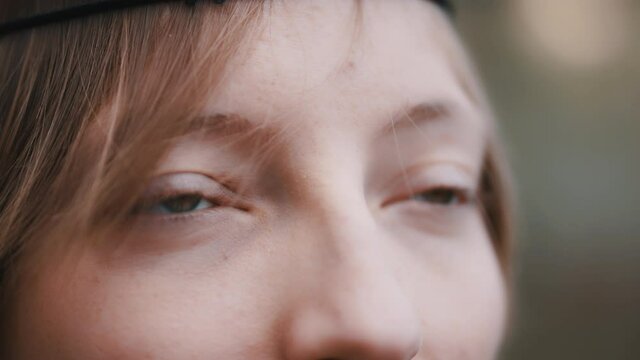Natural beauty concept. Extreme close up shot of woman face, green eyes. Racking focus.