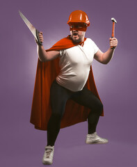 Super hero man holding construction tools. Engineer or Repairman in red helmet and super hero...
