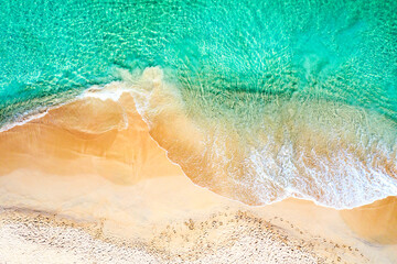 Top view aerial drone photo of ocean seashore with beautiful turquoise water and sea waves....