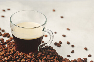 coffee in a glass Cup on the background of coffee beans