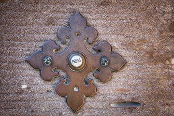 historic door bell on a stone wall