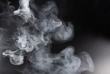 White steam on a black background.