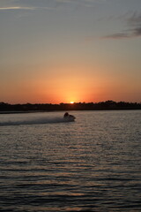 Sunset with jet-ski on intercoastal waterway, Jacksonville, Florida