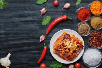 Traditional homemade lasagna and ingredients