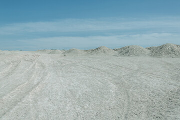 White desert and blue cloudy sky. Travel scene panorama.