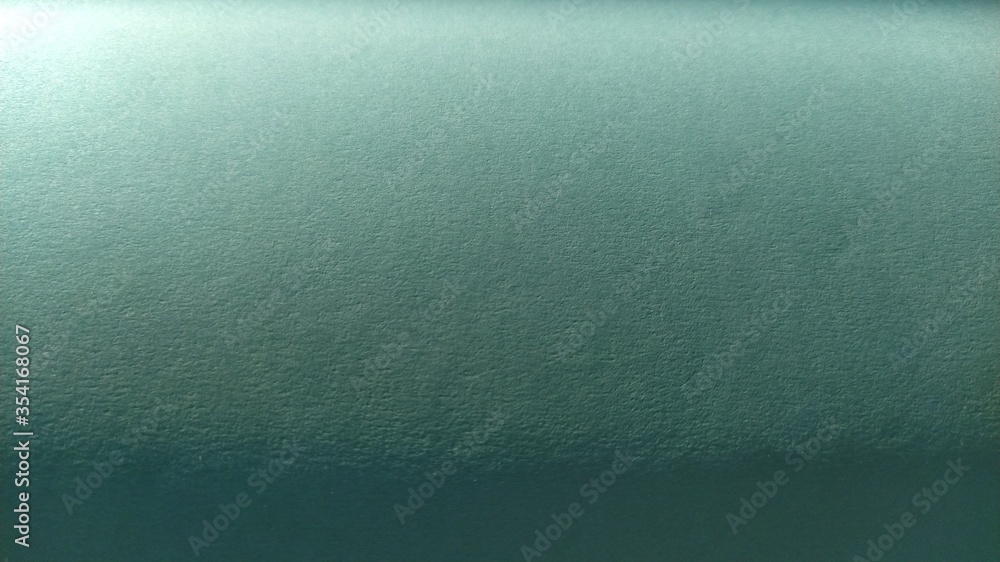Aufkleber a sheet of light green paper with vignetting at the bottom. calm green with fine paper texture. soot