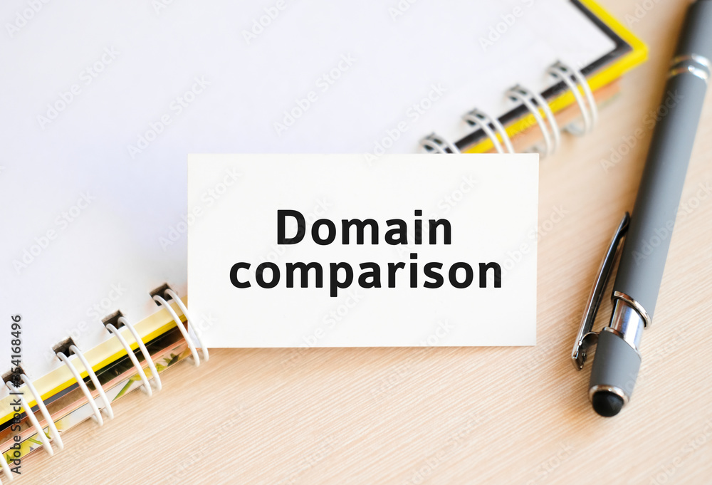 Poster domain comparison - text on a notebook with a spring and a gray pen