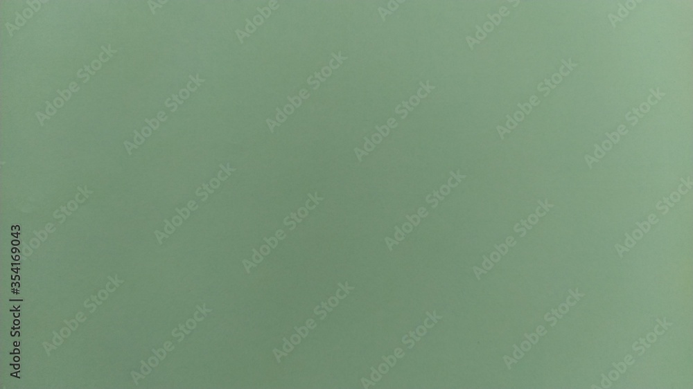 Aufkleber a sheet of light green paper with vignetting at the bottom. calm green with fine paper texture. soot