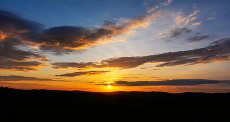 Natural sunset with dramatic sky and warm colors 