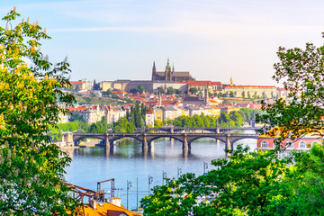 Fototapeta na wymiar View of Prague Castle from Vysehrad with lush green spring trees, Prague, Czech Republic