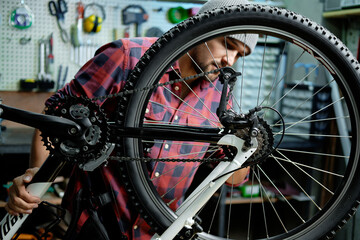 Man repairing a bicycle. Bicycle mechanic working