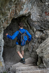 Man On Hiking Trail Enters A Cave In Ötschergräben In Austria