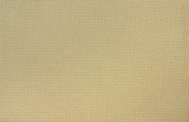 The beige Aida cotton fabric of uniform weave for cross stitch.