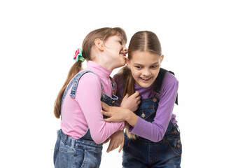 Girl bites her sisters ear having fun