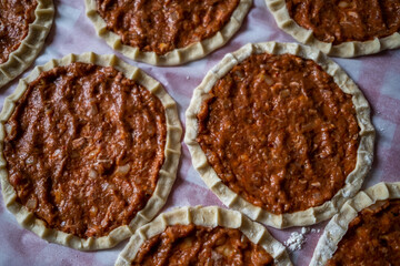 Top view of homemade pide, turkish flatbread with ground meat, mini pita breads or mini turkish pizzas